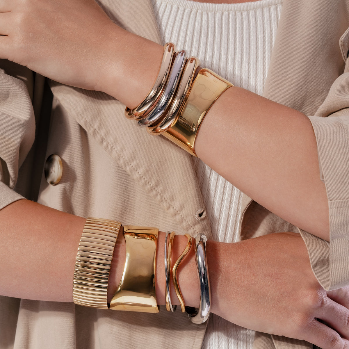 Sculptural Wave Open Cuff Bracelet worn on a model's wrist, close-up