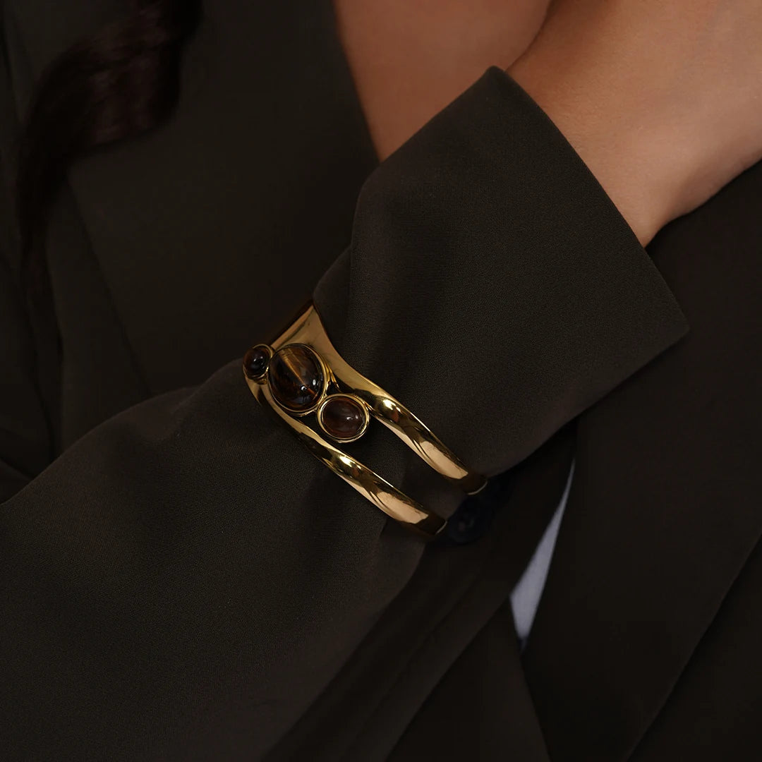 Tiger Eye Gemstone Cuff Bracelet in Gold Vermeil worn on a model's wrist, close-up