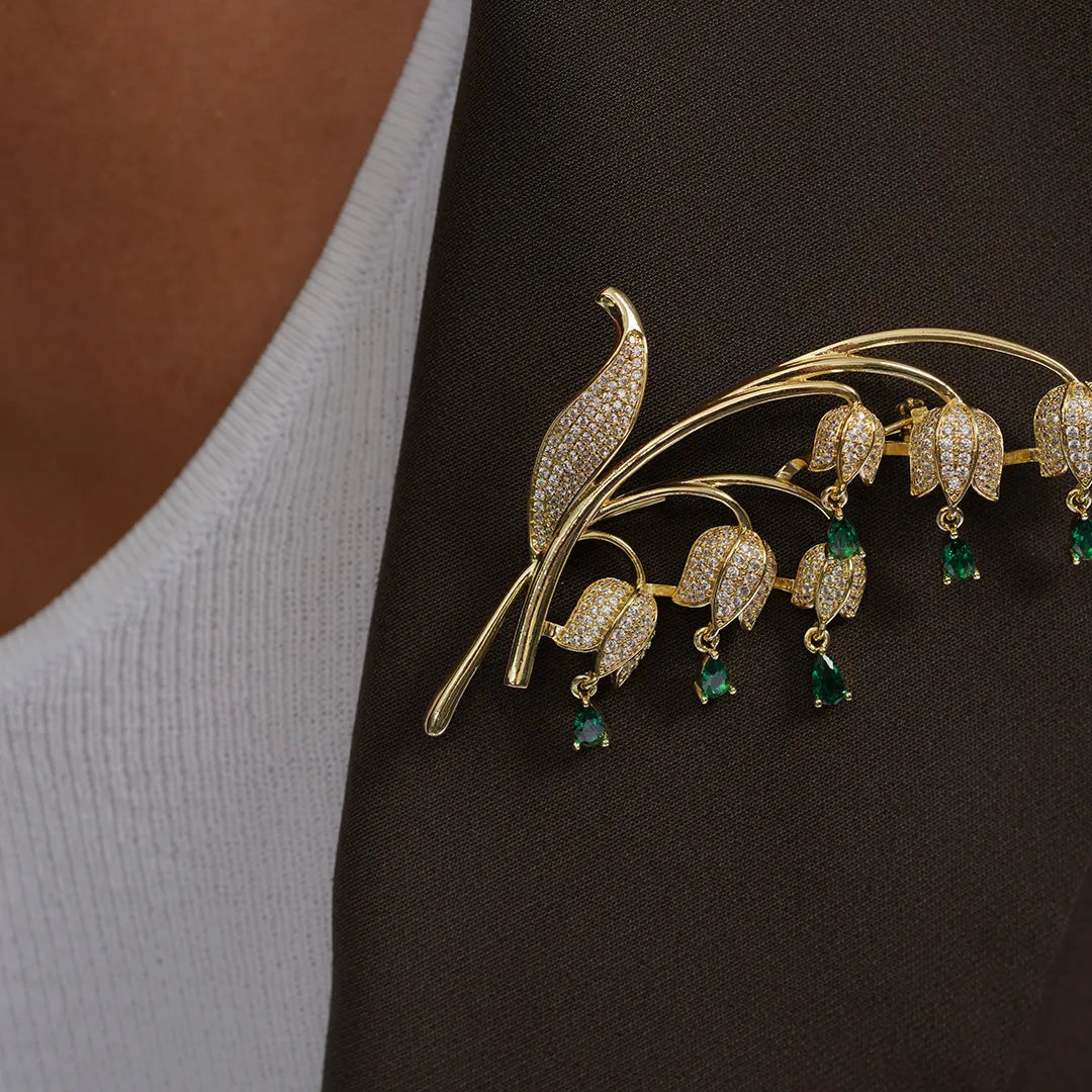 Lily of the Valley Flower Brooch with Cubic Zirconia Accents pinned to a model's outfit
