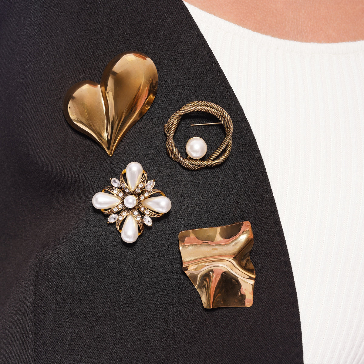 Model wearing Zard Jewelry brooches, close-up