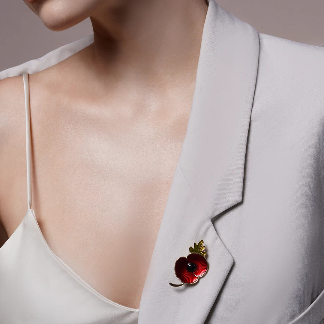 Red Enamel Poppy Flower Brooch Pin pinned to a model's outfit