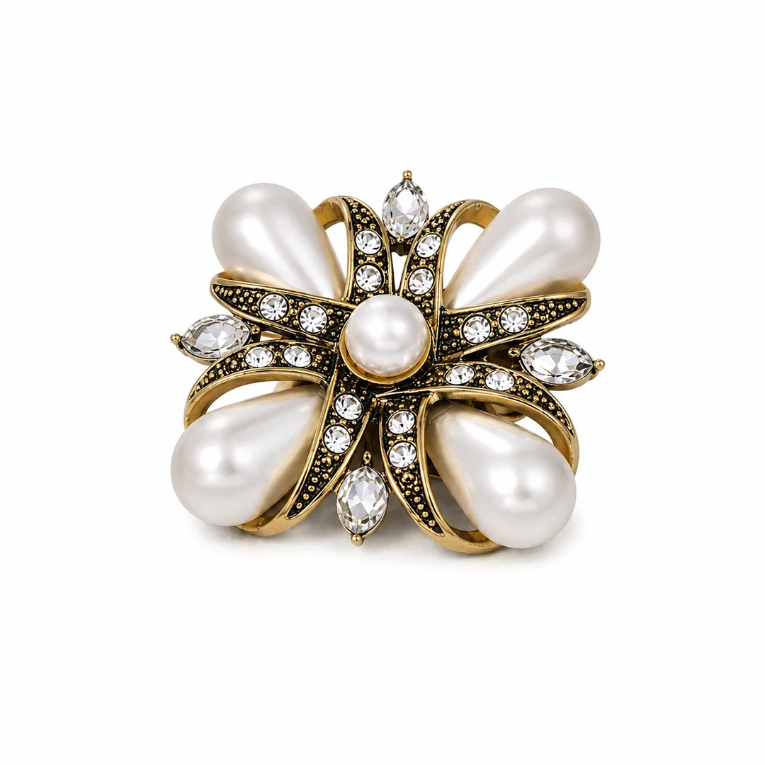 Vintage-style brooch with large white pearls and gold-tone metalwork accented with clear crystals