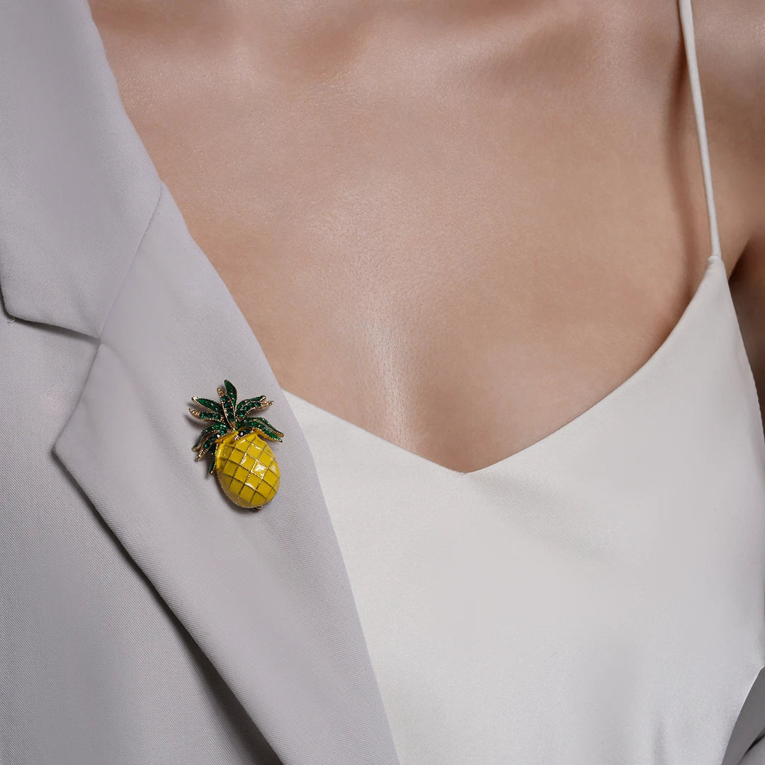 Yellow Enamel Pineapple Brooch pinned to a model's outfit