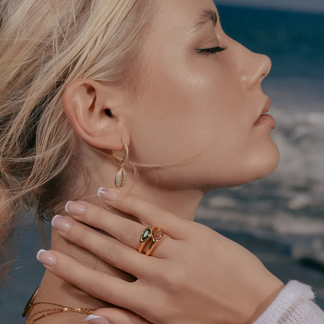Model wearing Cowrie Shell Hoop Earrings in CZ Accent, alternate pose