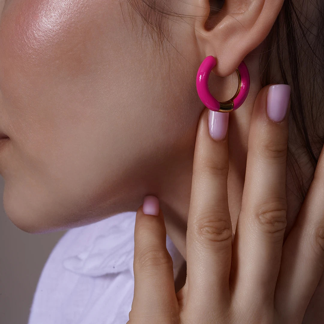 Model wearing Enamel Hoop Earrings, close-up