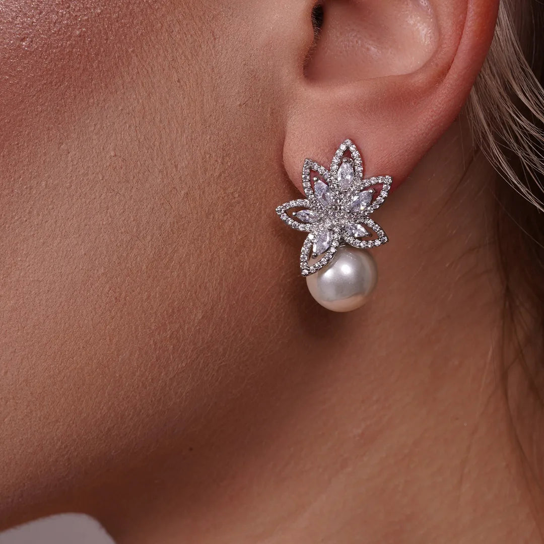 Model wearing Flower Petals Cubic Zirconia and Pearl Earrings, alternate pose