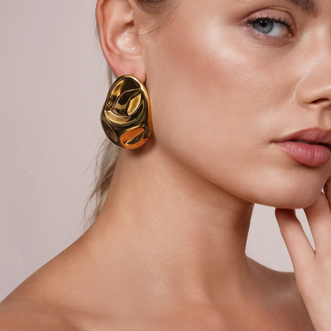 Model wearing Hammered Statement Chunky Earrings In Gold and Silver, alternate pose