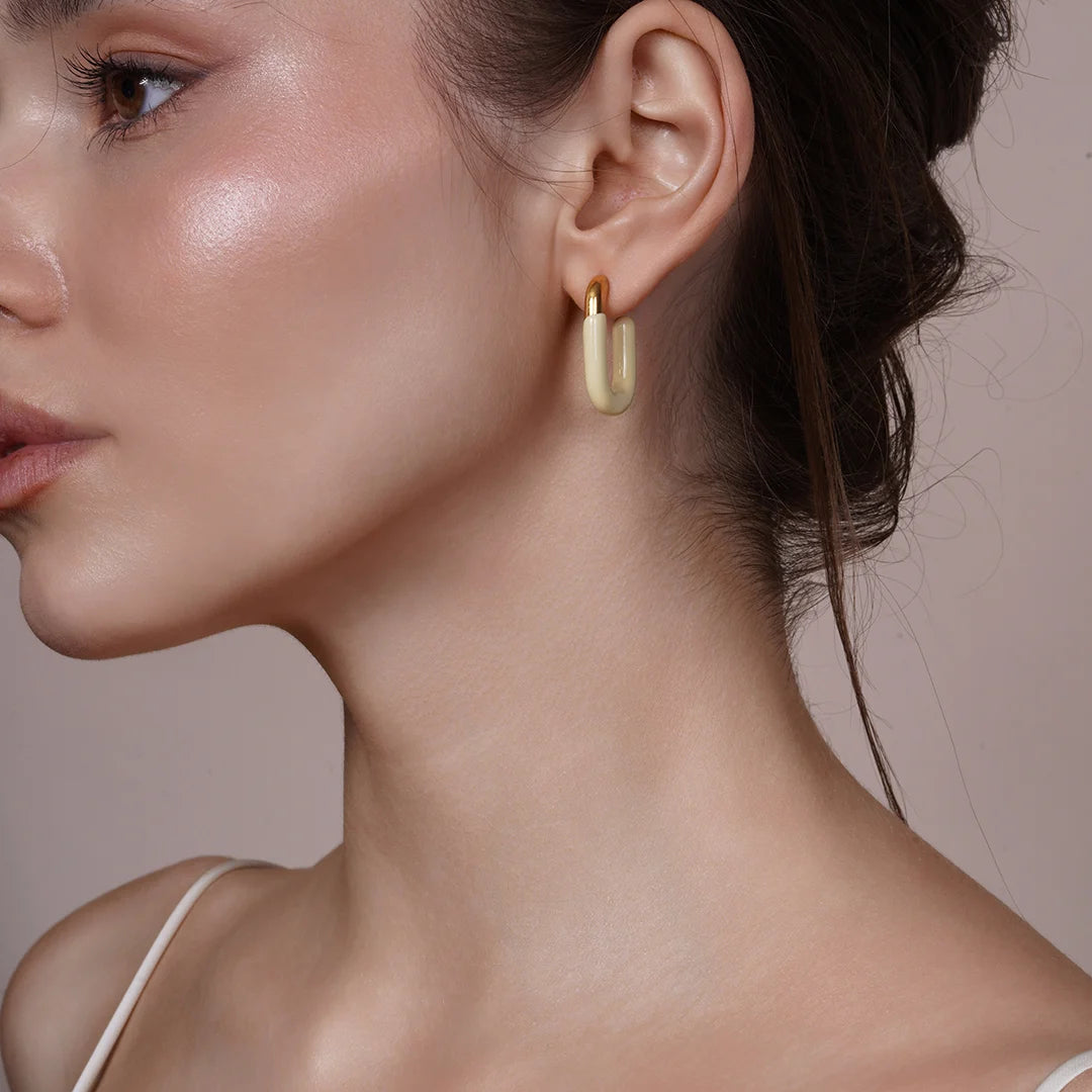 Model wearing Large Enamel Oval Hoop Earrings