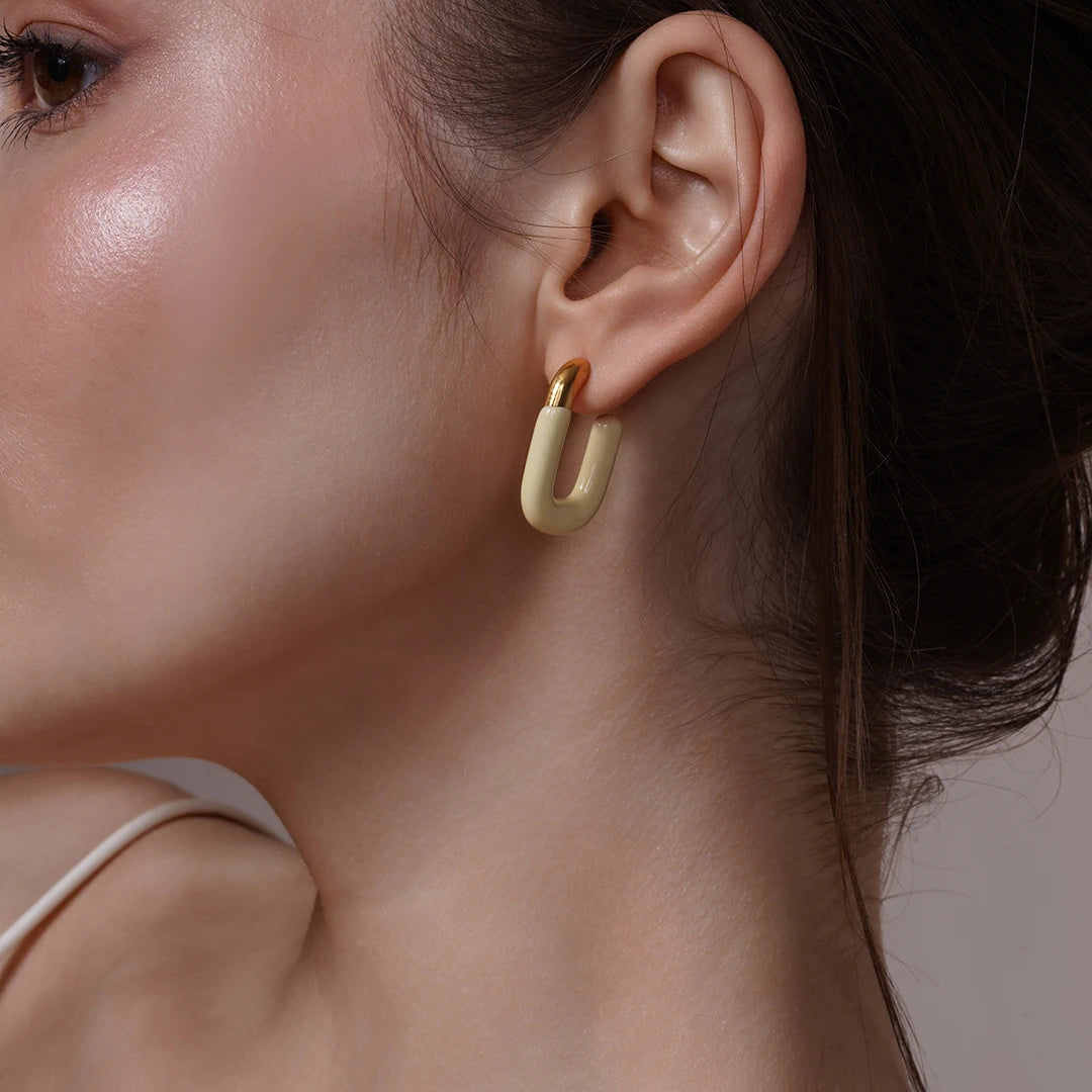 Model wearing Large Enamel Oval Hoop Earrings, styled look