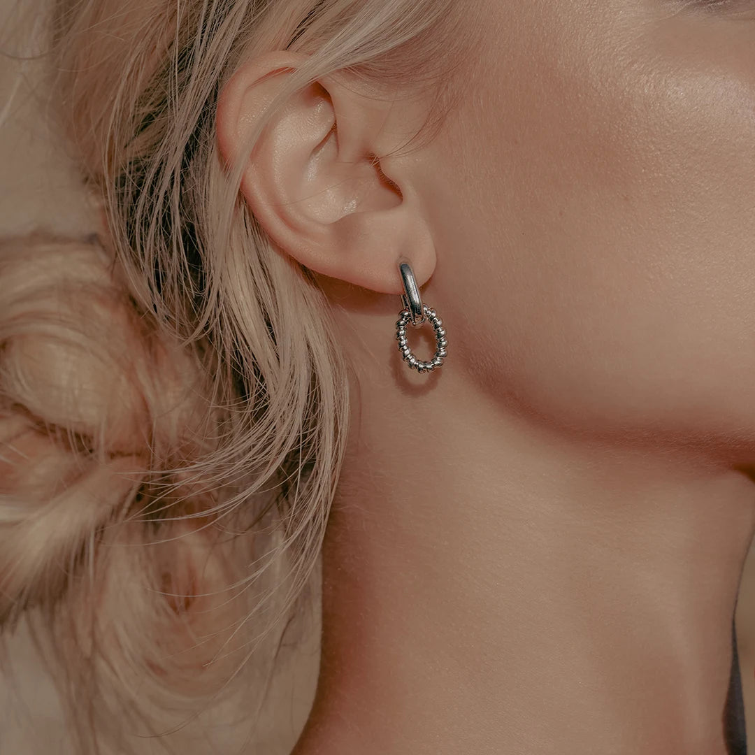 Model wearing Zard Jewelry Multi-Wear Double Hoop Huggie Earrings