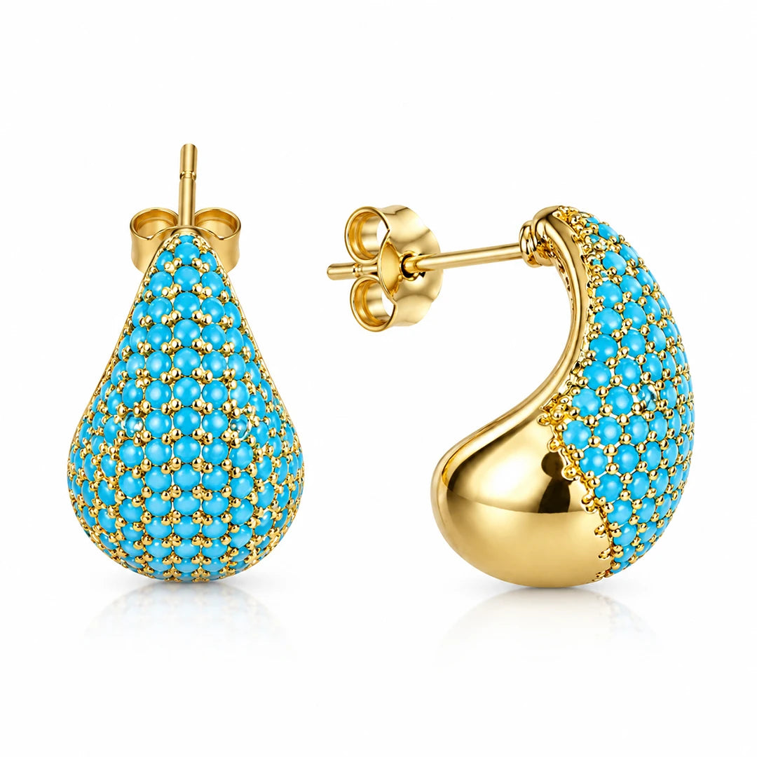 Gold-tone teardrop stud earrings with turquoise-blue pavé accents, shown from front and side.