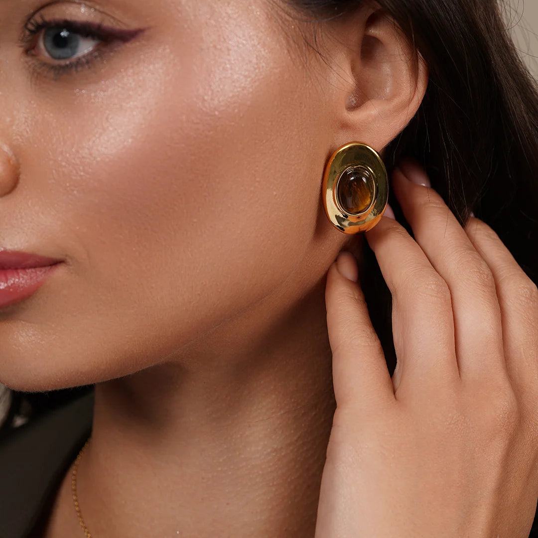 Model wearing Zard Jewelry Tiger Eye Crystal Chunky Stud Earrings in Gold