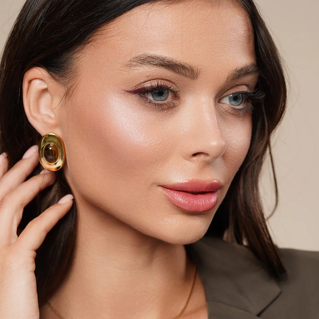 Model wearing Tiger Eye Crystal Chunky Stud Earrings in Gold, styled look