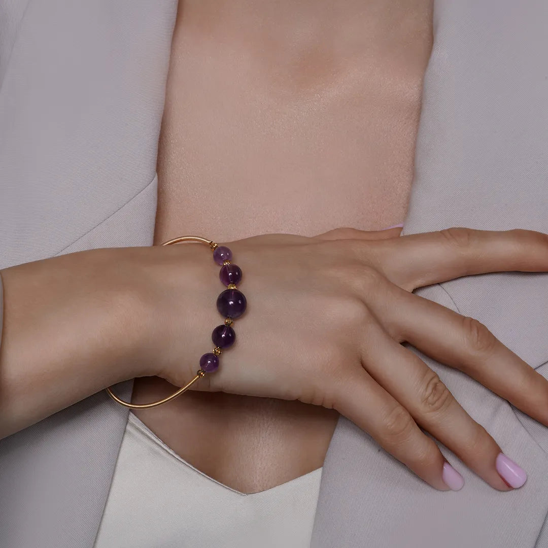 Amethyst Beaded Gold Open Wire Bracelet worn on a model's wrist, alternate pose
