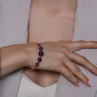 Amethyst Beaded Gold Open Wire Bracelet worn on a model's wrist, alternate pose
