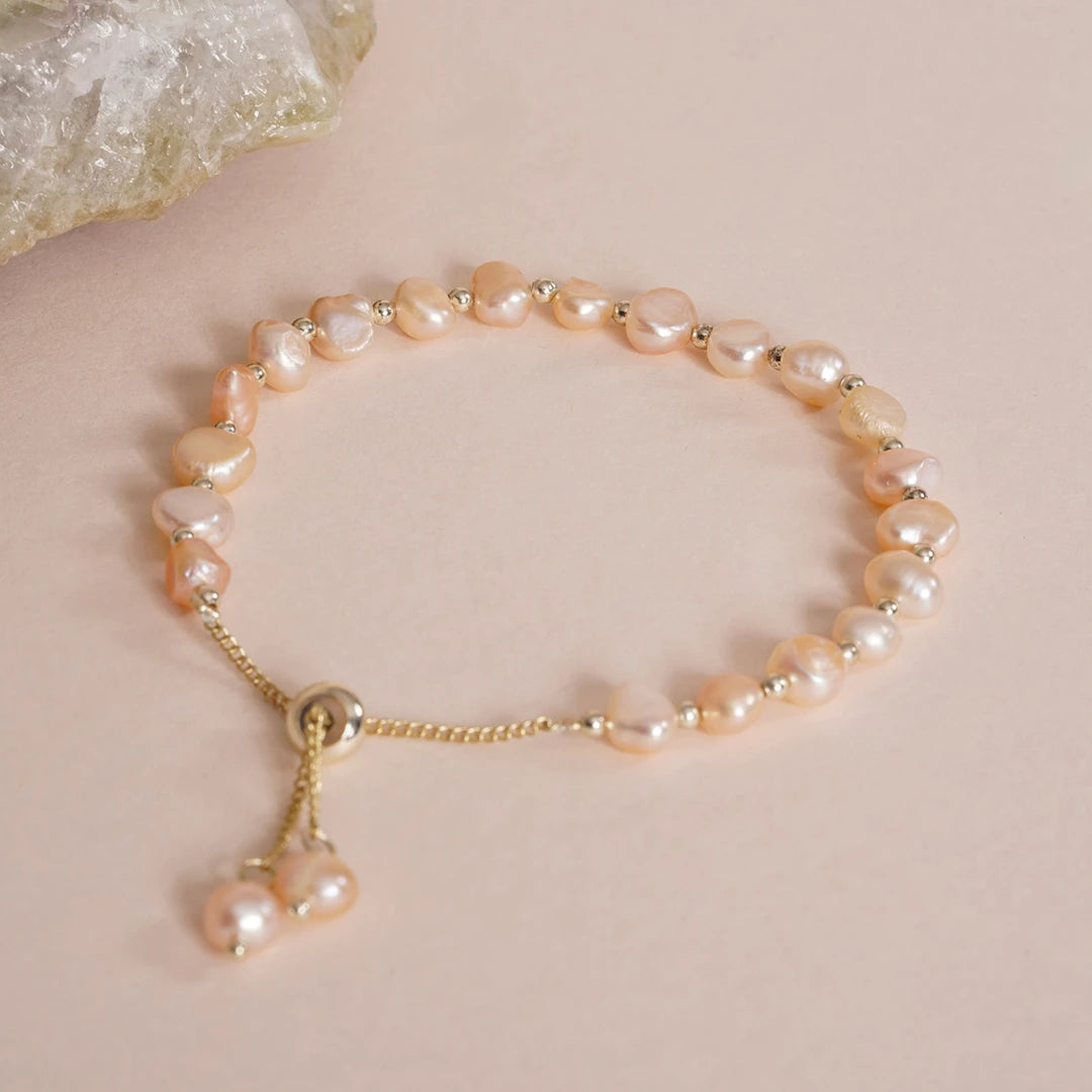 Baroque Pearl Beaded Pull-Through Bolo Bracelet styled on a soft-toned background