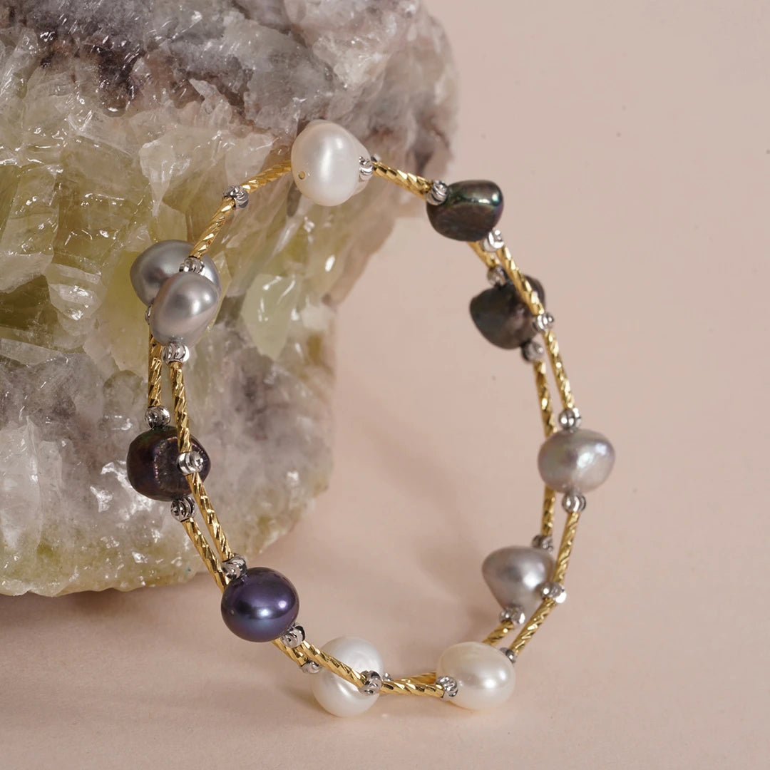 Baroque Pearl Spiral Wrap Bracelet styled on a soft-toned background