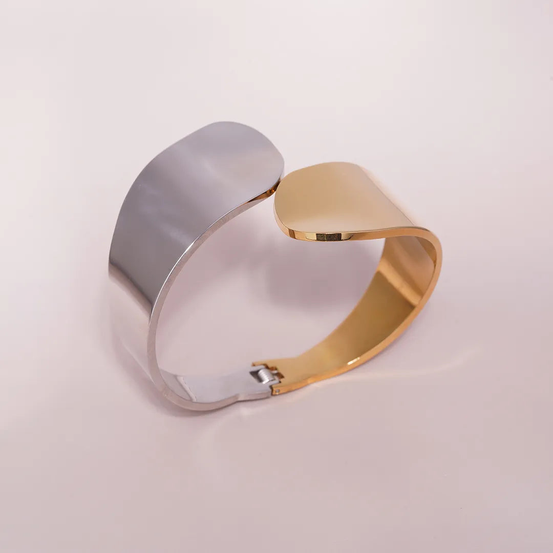 Bold Sculptural Cuff Bracelet styled on a soft-toned background