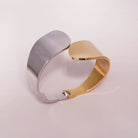 Bold Sculptural Cuff Bracelet styled on a soft-toned background