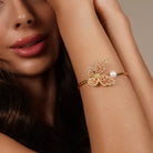 Butterfly Pearl Open Cuff Bracelet worn on a model's wrist, alternate pose
