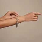 Chunky Link Chain Bracelet in Gold Silver Combination worn on a model's wrist