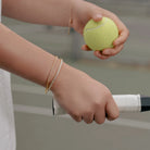 Half Paperclip Half Tennis Bracelet in CZ worn on a model's wrist, alternate pose