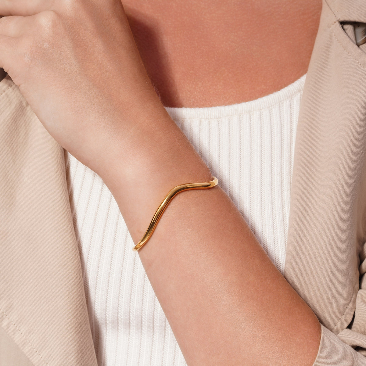 Sculptural Wave Open Cuff Bracelet worn on a model's wrist
