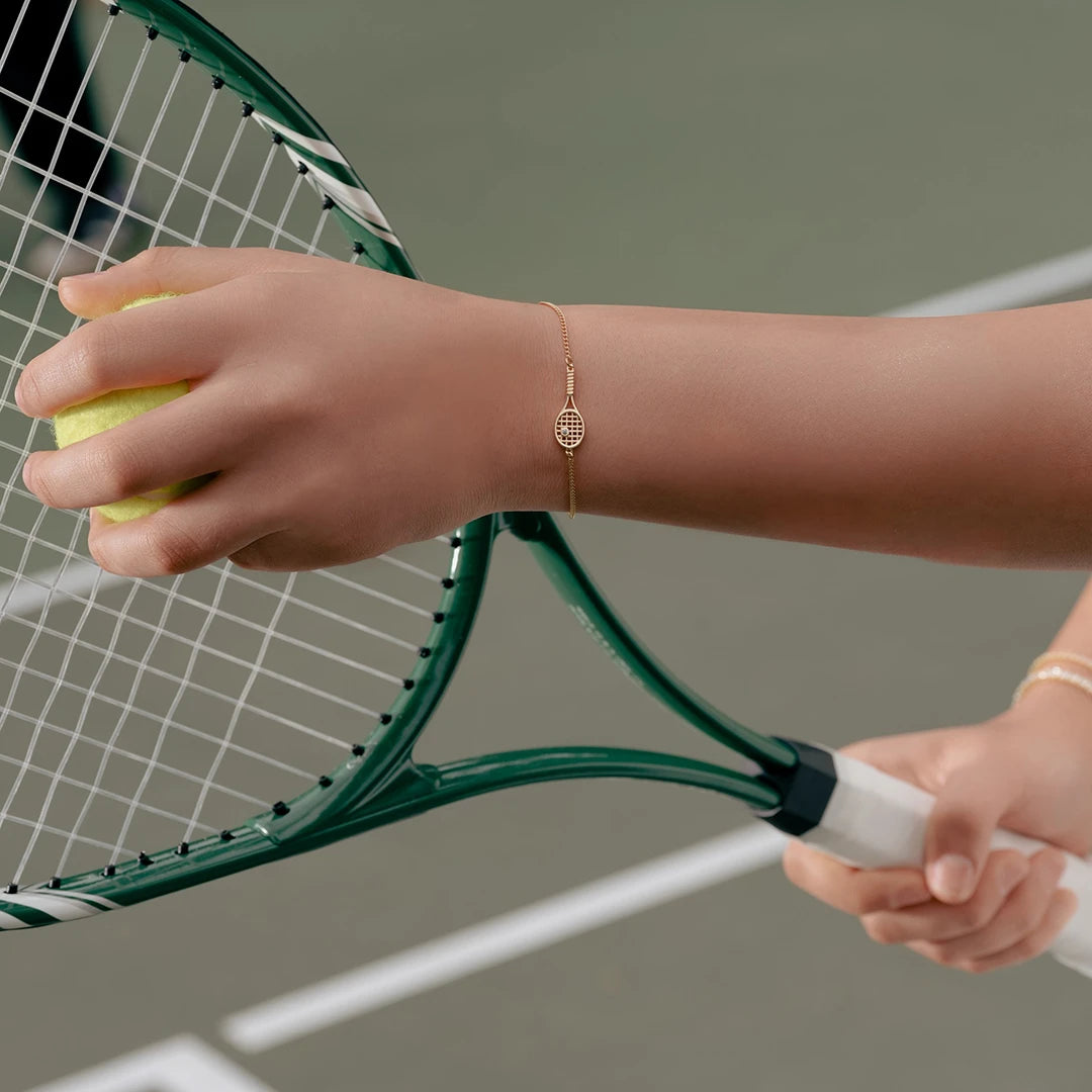 Tennis Racket Charm Bracelet worn on a model's wrist