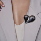 Chunky Puffy Heart Brooch Statement Pin pinned to a model's outfit