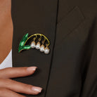 Lily of the Valley Flower Brooch with Dangling Pearl Accent pinned to a model's outfit
