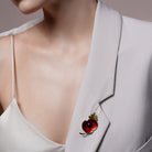 Red Enamel Poppy Flower Brooch Pin pinned to a model's outfit