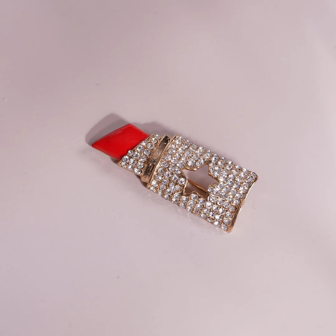 Red Lipstick Brooch in Crystal Rhinestone Accent styled on a soft-toned background