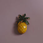 Yellow Enamel Pineapple Brooch styled on a soft-toned background