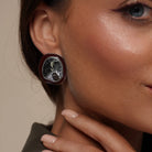 Model wearing Chunky Oval Stud Earrings in Enamel Accent, alternate pose