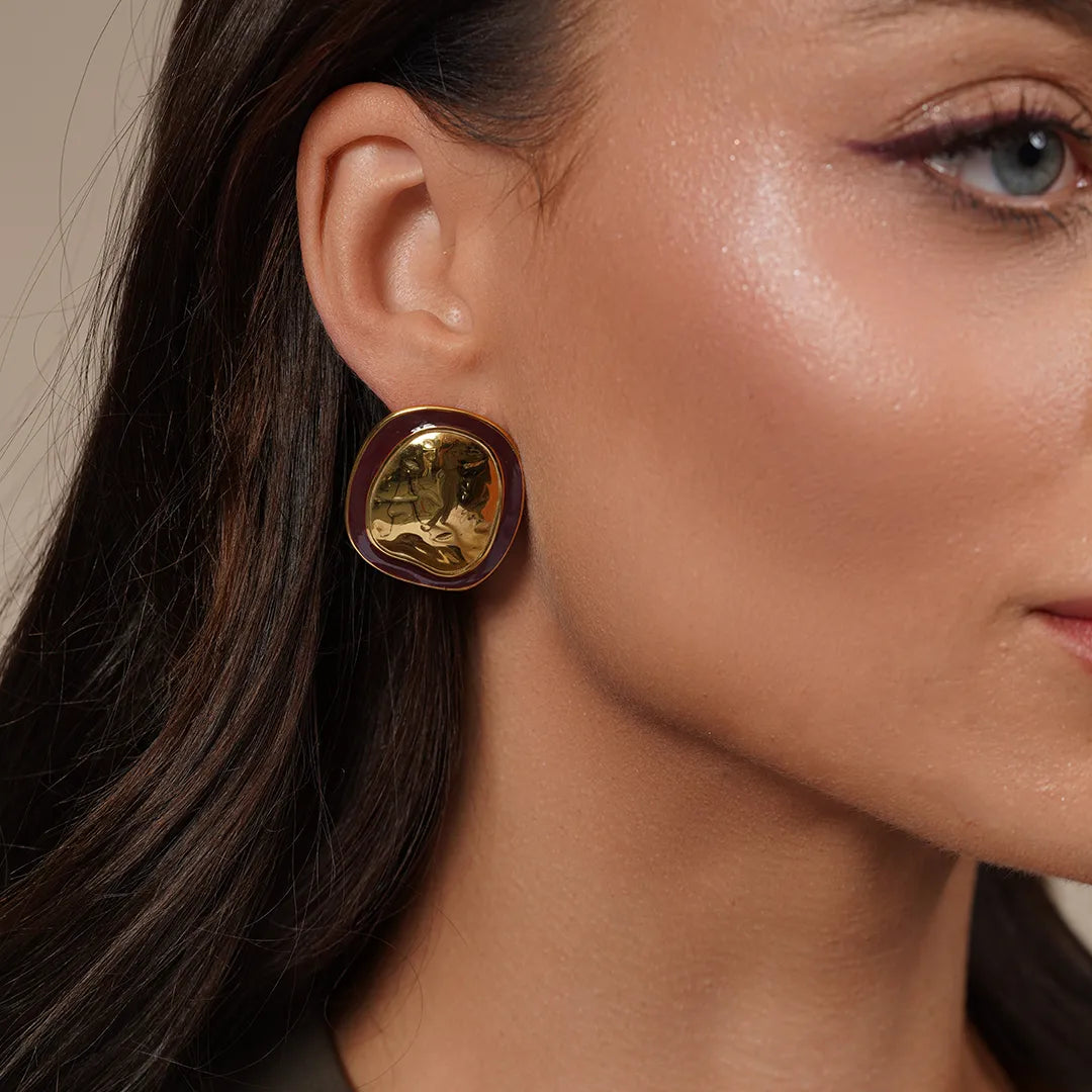 Model wearing Chunky Oval Stud Earrings in Enamel Accent, close-up