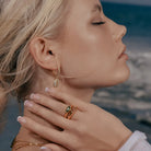 Model wearing Cowrie Shell Hoop Earrings in CZ Accent, alternate pose