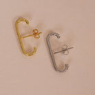 CZ Lobe Cuff Studs Suspender Earrings Gold and Silver styled on a soft-toned background