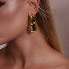 Model wearing Double Rectangle Drop Earrings, alternate pose