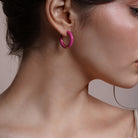 Model wearing Enamel Hoop Earrings, alternate pose