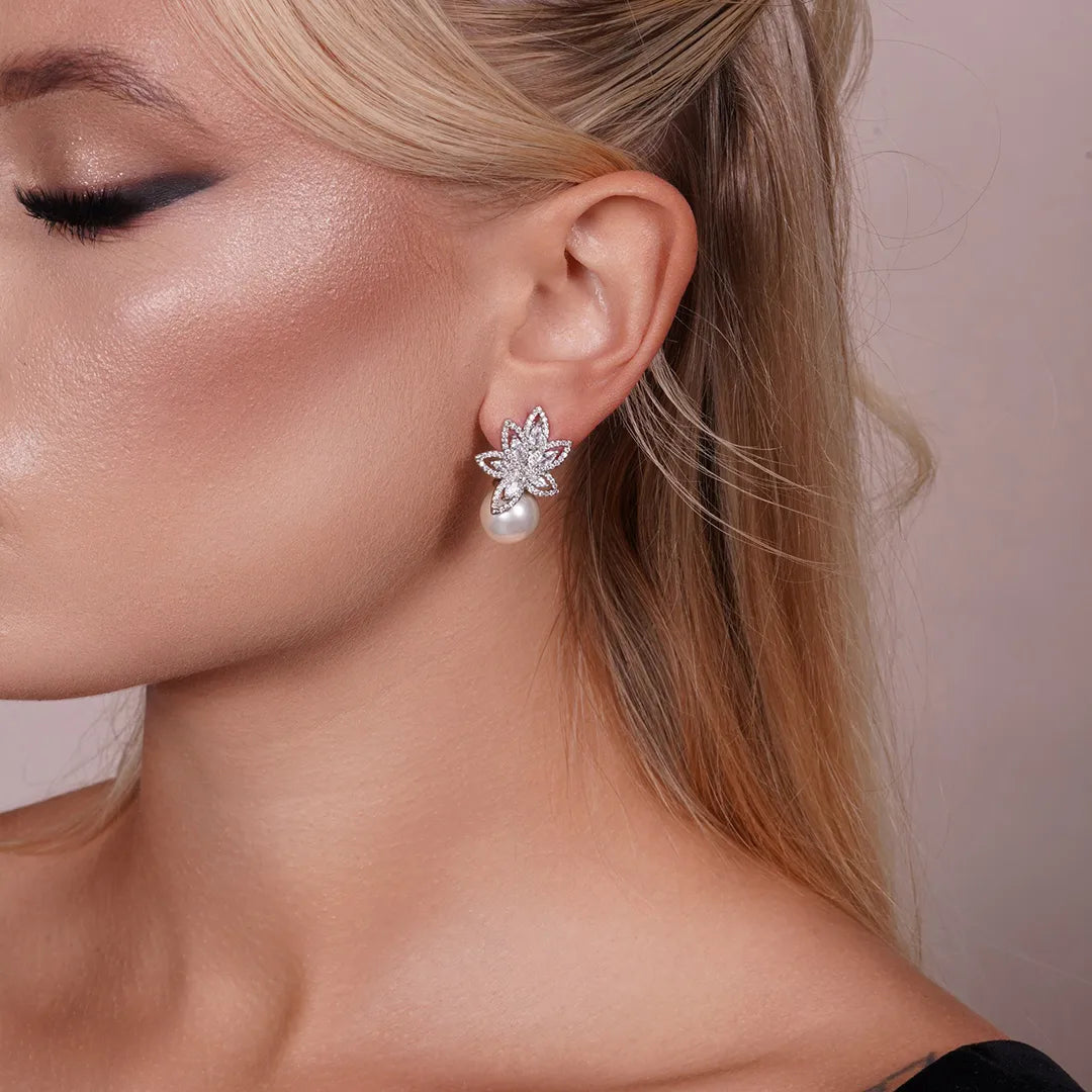 Model wearing Flower Petals Cubic Zirconia and Pearl Earrings, close-up