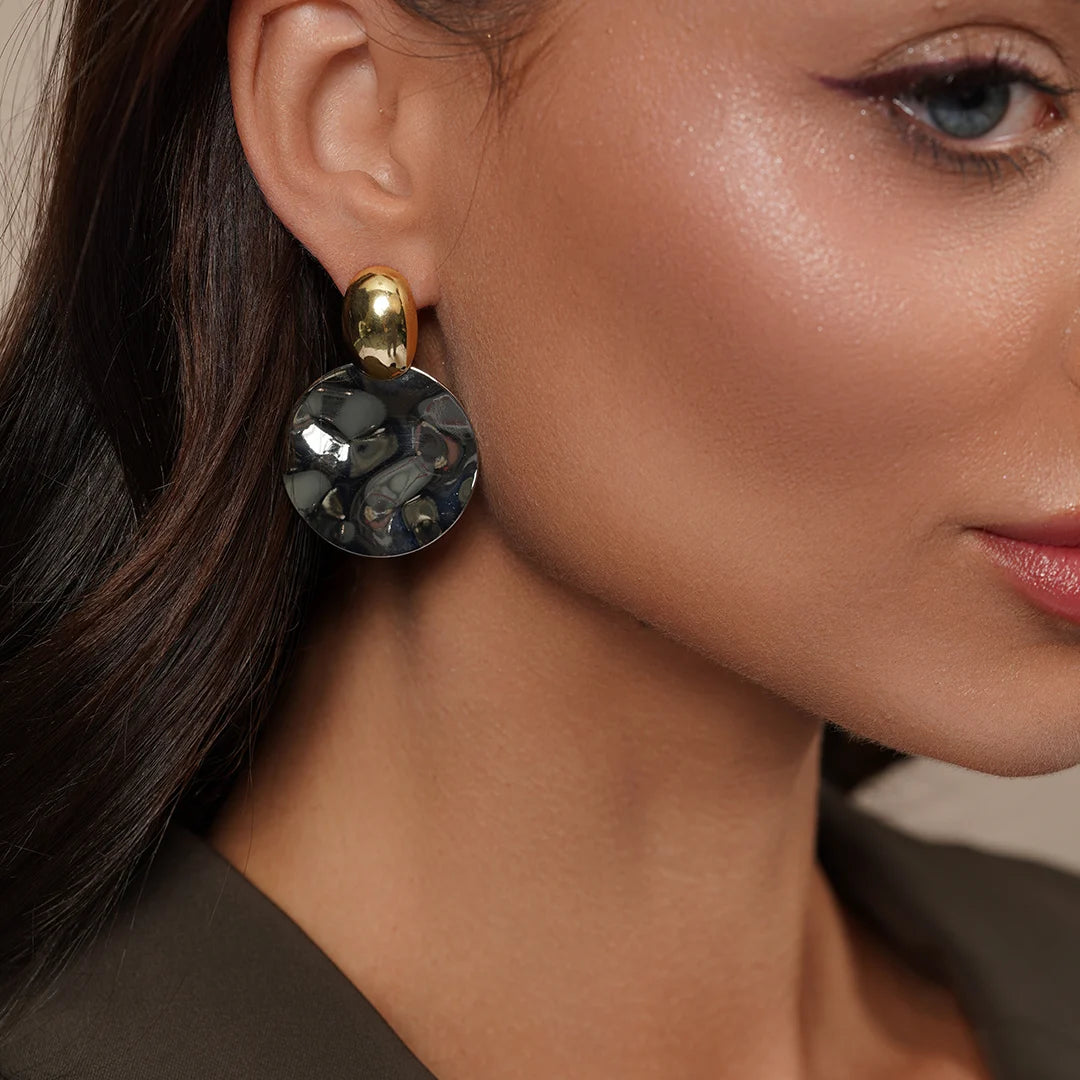 Model wearing Zard Jewelry Hammered Silver Disc Drop Earrings