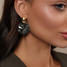 Model wearing Zard Jewelry Hammered Silver Disc Drop Earrings
