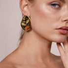 Model wearing Hammered Statement Chunky Earrings In Gold and Silver, alternate pose