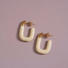 Large Enamel Oval Hoop Earrings, yellow styled on a soft-toned background