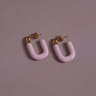 Large Enamel Oval Hoop Earrings, lilac styled on a soft-toned background