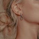 Model wearing Zard Jewelry Multi-Wear Double Hoop Huggie Earrings