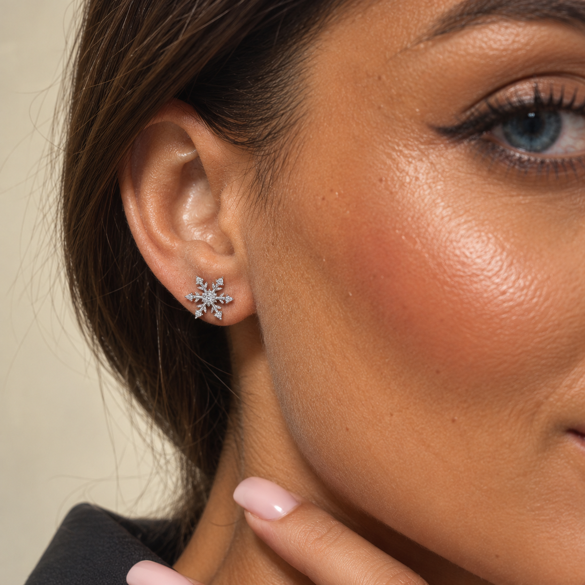 Model wearing Dainty Snowflake Stud Earrings in 925 Sterling Silver with Cubic Zirconia