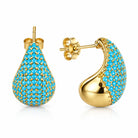 Gold-tone teardrop stud earrings with turquoise-blue pavé accents, shown from front and side.