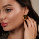 Model wearing Tiger Eye Crystal Chunky Stud Earrings in Gold, close-up