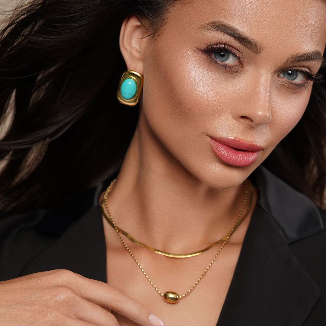 Model wearing Zard Jewelry Turquoise Crystal Gem Chunky Stud Earrings in 18k Gold